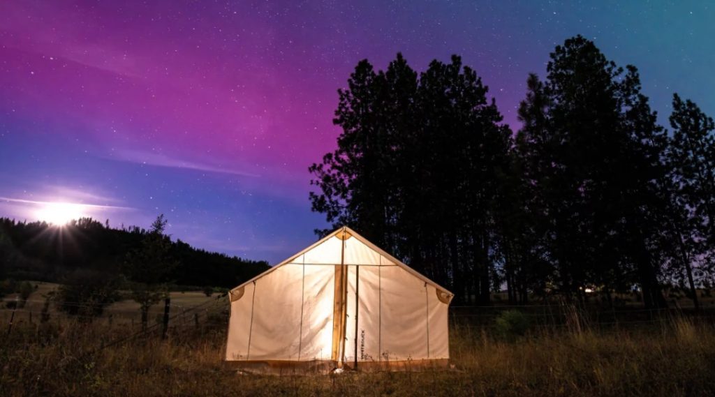Wall tent at campsite for stargazing.