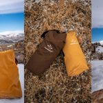 WhiteDuck Hoplite Series bags displayed outdoors in winter and fall conditions, including yellow, brown, and olive duffel-style carry bags shown on snow and dry grass.