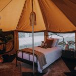 Separate sleeping and living areas inside a spacious camping tent for added comfort, privacy, and better organization.