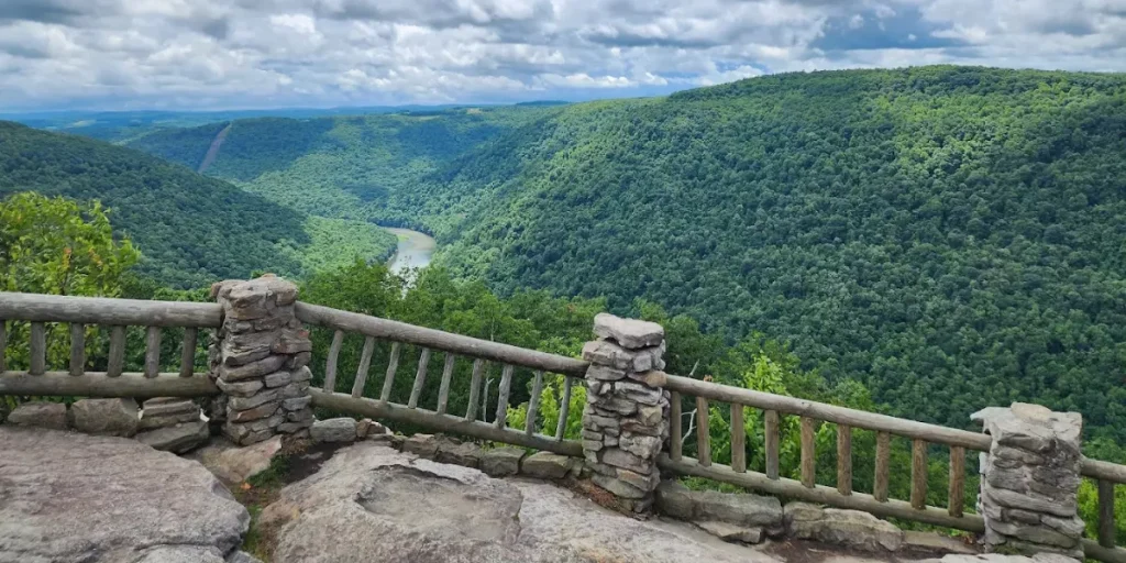 A scenic view of the lush green Cheat River Gorge from the stone overlook at Coopers Rock State Forest. Credit: Coopers Rock State Forest GMB