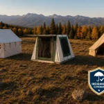 Business tents set up at a scenic campsite with permits and insurance badges