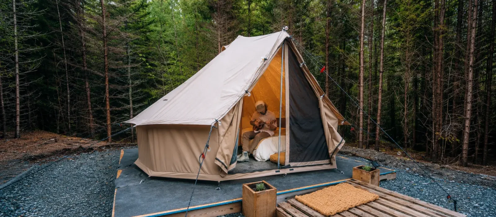 Solo glamping in a canvas tent surrounded by a peaceful forest