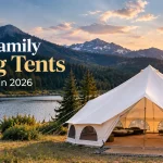23-foot Avalon Optimus Bell Tent set up for family camping beside a scenic mountain lake